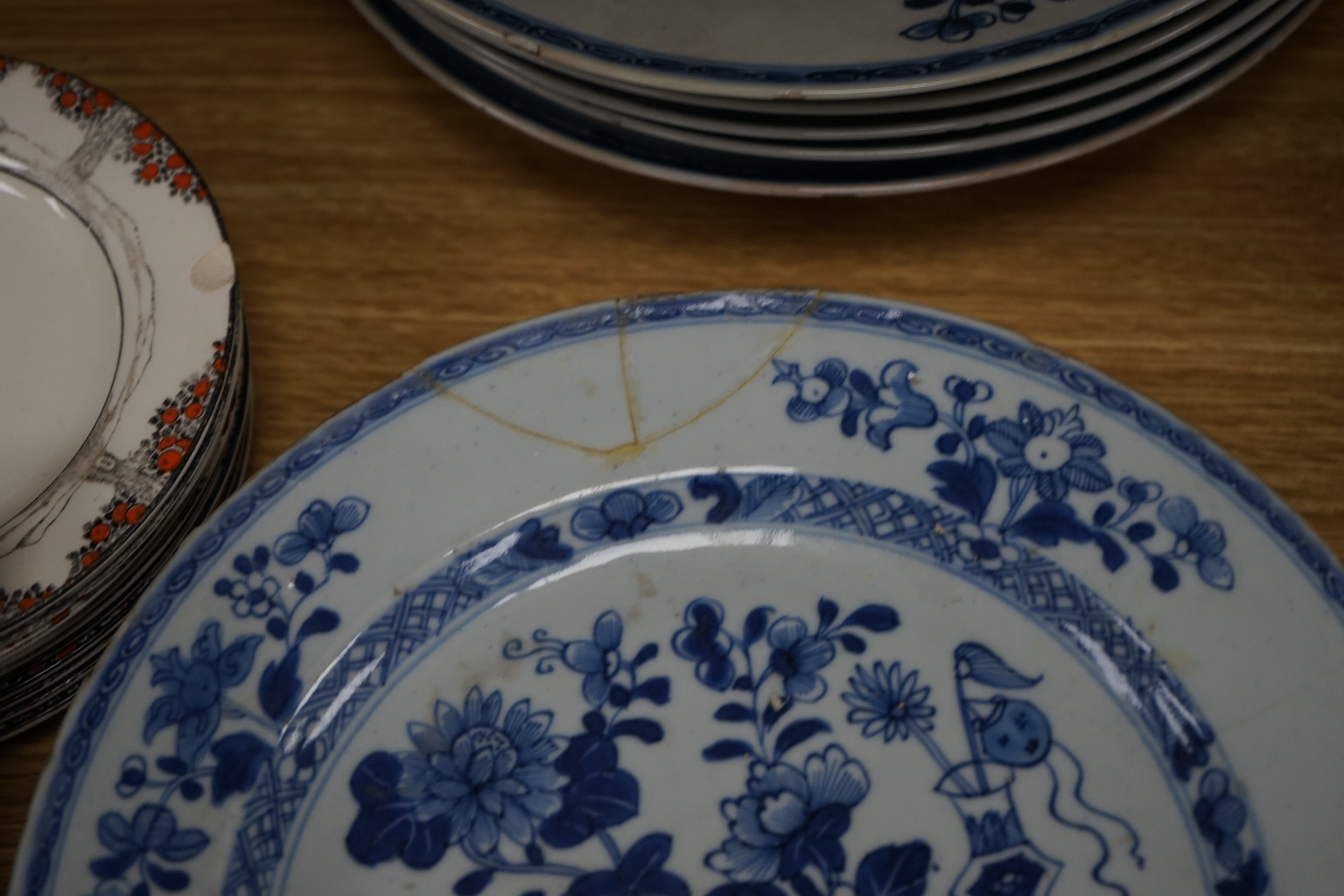 An 18th century Chinese Export blue and white octagonal tureen and cover, decorated with birds and flowers, a pair of similar sauceboats and five plates decorated with urns of flowers
